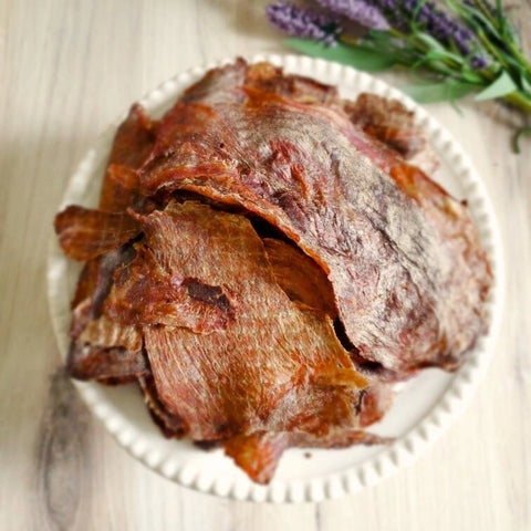 A close-up image of a pile of Camel jerky on a plate that highlights its interesting texture and colors
