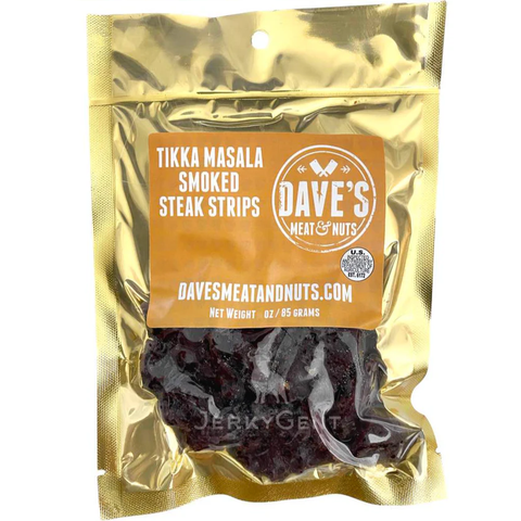 Front of Dave’s Meat & Nuts Tikka Masala Smoked Steak Strips in a gold resealable pouch