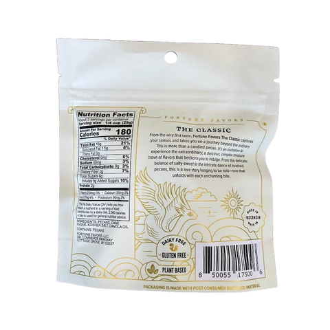 Back of Fortune Favors 'The Classic' candied pecans bag, showing nutrition facts, ingredients list, and a whimsical description of the product. Illustrated with gold artwork of a winged unicorn and labeled with dietary icons: dairy free, gluten free, and plant-based. Text highlights the pecans’ sweet and salty flavor profile and enchanting snacking experience.