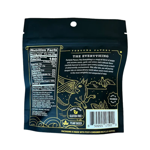 Back of Fortune Favors 'The Everything' candied pecans bag, featuring nutrition facts, ingredient list, and a whimsical product description. The dark packaging showcases gold illustrations of a winged creature under a starry sky and highlights that the product is dairy free, gluten free, plant-based, and made in Wisconsin.