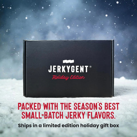 JerkyGent Holiday Edition black gift box in the snow with text reading “Packed with the season’s best small-batch jerky flavors. Ships in a limited edition holiday gift box” against a snowy night backdrop.