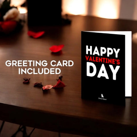Valentine's Day greeting card on wooden table with red rose petals, text reads "Greeting Card Included"