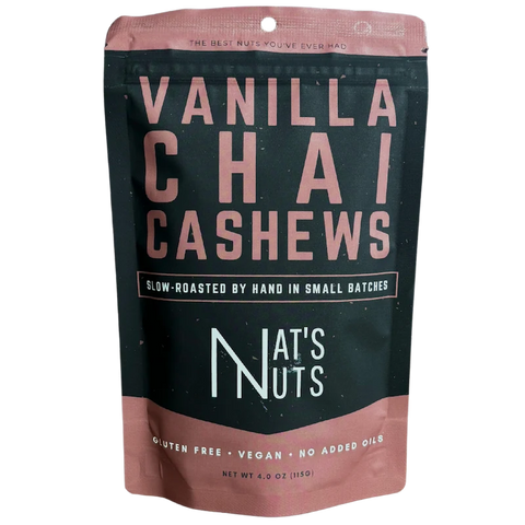 Front view of Nat’s Nuts Vanilla Chai Cashews pouch with bold lettering and sleek black-and-copper color scheme.