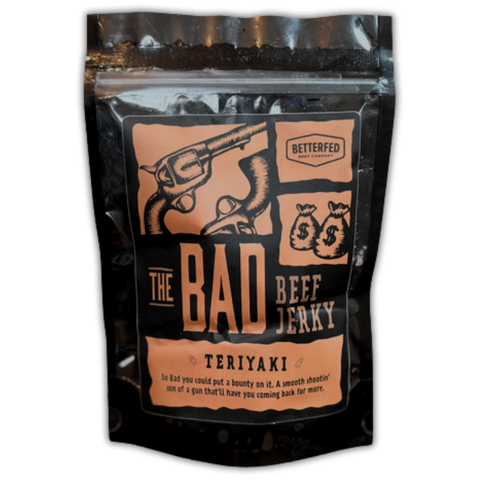 Bag of The Bad Beef Jerky by Betterfed Meat Co. – Teriyaki flavor with orange label featuring crossed pistols and money bag graphics.
