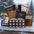 JerkyGent beef jerky Holiday gift box displayed in the snow, filled with assorted small-batch beef jerky bags against a snowy winter background.