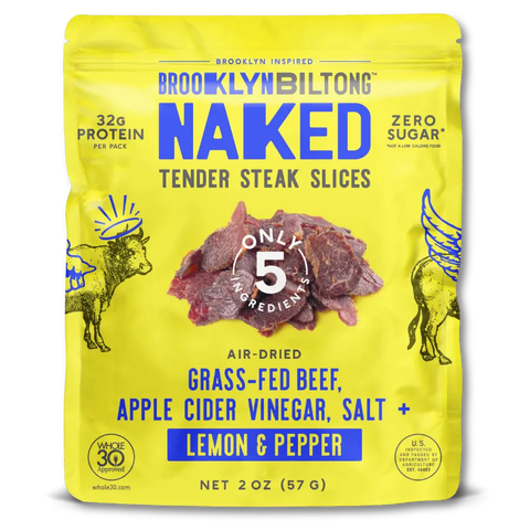 Yellow package of Brooklyn Biltong Naked Tender Steak Slices with beef slices and branding details.