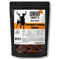 A black stand-up pouch of Cowboy Cody's Beef Jerky, Pineapple Teriyaki Brisket, featuring a white and orange label with a cow graphic and a clear window showing the dark brown jerky inside.