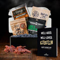 Assorted beef jerky packages with a 'Happy Father's Day' card on a dark background