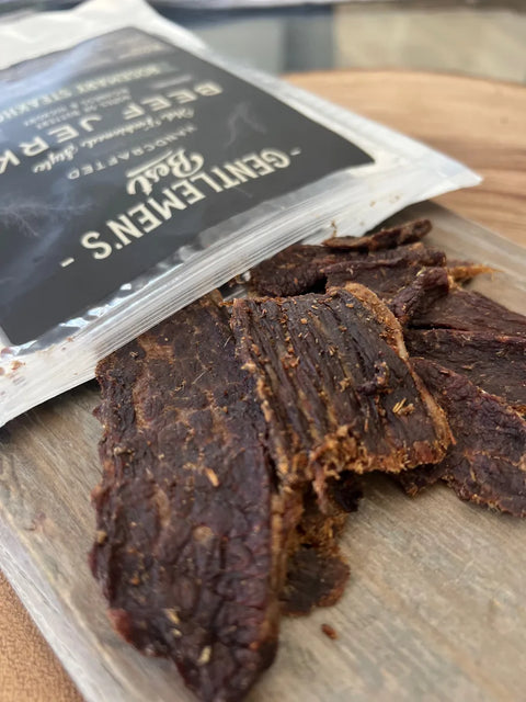 Gentlemen's Best rosemary steakhouse beef jerky opened and laid out on table