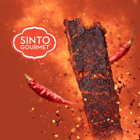 close up of peoples choice gochujang beef jerky showing the spices and seasong with a Sinto Gourmet logo.