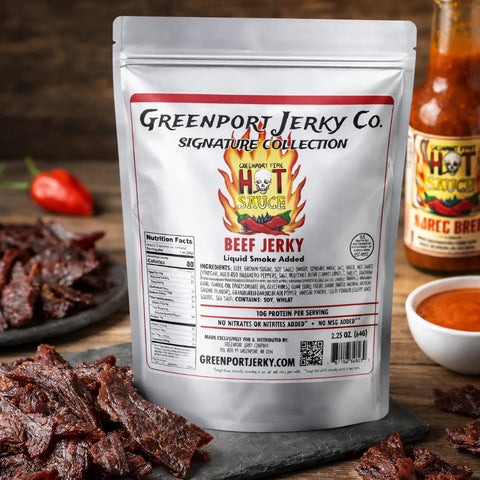 Greenport Jerky Co. beef jerky package with hot sauce in the background