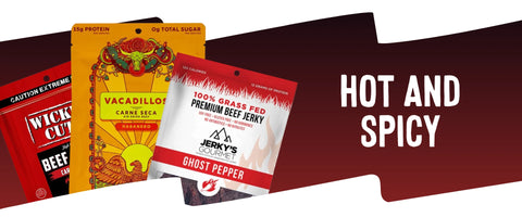 Hot and Spicy Jerky Collection featuring Wicked Cutz Carne Asada, Vacadillos Habanero, and Jerky’s Gourmet Ghost Pepper beef jerky bags with bold red background.