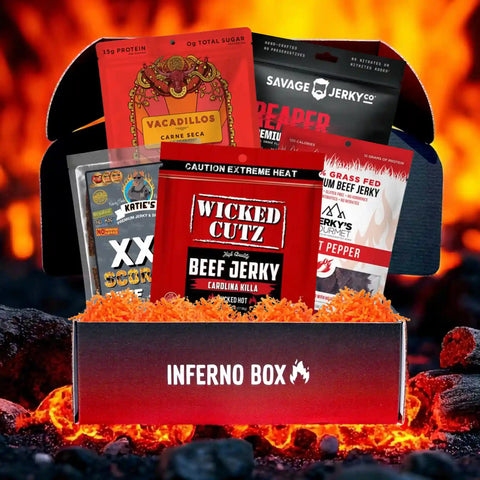 JerkyGent Inferno Box filled with five ultra-spicy beef jerky brands, displayed with flames and fiery background, perfect for heat lovers.