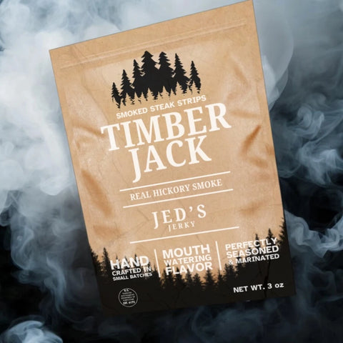 Jed's Jerky Timber Jack Real Hickory Smoked tender steak strips with smoky background