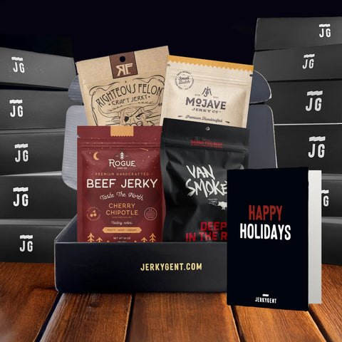 Assorted beef jerky packages with 'Jerky Gent' branding on a wooden surface.