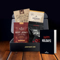 Assorted beef jerky packages from different brands on a stand with 'Happy Holidays' card.