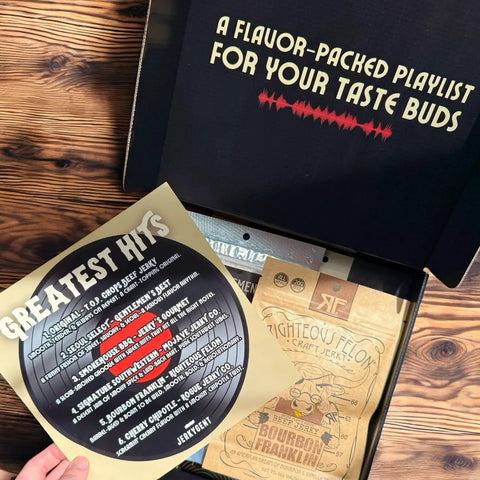 JerkyGent's Greatest Hits Beef Jerky Gift Box unboxing experience showing the track list and and opened box of beef jerky.