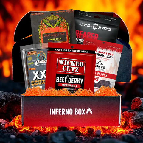 Inferno Box featuring spicy craft jerky packs from brands like Vacadillos, Savage Jerky Co., Wicked Cutz, Jerky’s Gourmet, and Katie’s, displayed with fiery background and bold “Inferno Box” label.