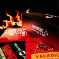 The JerkyGent Inferno Box with “Warning: Contents May Be Hot” printed on the side, shown with fiery background and spicy jerky packs.