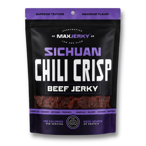 A black stand-up pouch of Max Jerky Sichuan Chili Crisp Beef Jerky, featuring a purple and white label design with a clear window showing the reddish-brown jerky inside.