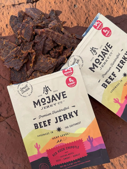 Mojave Red Rock Chipotle lifestyle photo showing the jerky on red rocks