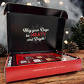 Opened Holiday beef jerky gift box on a table with pinecones and smoke in the background