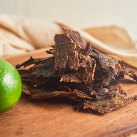 A photo of a freshly created batch of beef jerky that is ready to share and eat