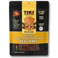 A package of Tiki Hawaiian Gourmet Sunset Pineapple Teriyaki Beef Jerky, featuring a black and yellow resealable pouch with a clear window showing the jerky inside.