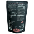 Back of Nat’s Nuts Vanilla Chai Cashews pouch featuring nutrition label, ingredients, and a teacup illustration.