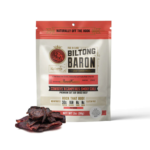 Biltong baron cowboys and campfires beef filtong package next to a pile of delicious biltong.