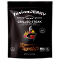 Front of Fusion Jerky Grilled Steak Beef Jerky bag featuring a grill illustration with flames, gluten-free icon, and product details like 'Artisan Beef Jerky' and 'Made in USA'.