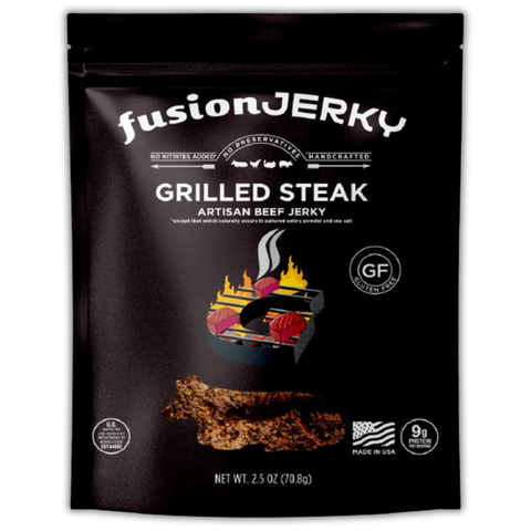 Front of Fusion Jerky Grilled Steak Beef Jerky bag featuring a grill illustration with flames, gluten-free icon, and product details like 'Artisan Beef Jerky' and 'Made in USA'.