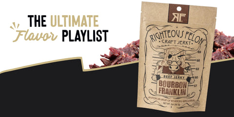 Brown kraft-style packaging for Righteous Felon Craft Jerky in Bourbon Franklin flavor. Features a cartoon outlaw cow holding a mugshot board. Tagline reads ‘An American Dream of Bourbon & Vanilla Bean.’ Surrounded by jerky chunks with text above reading ‘The Ultimate Flavor Playlist’ in gold and black.