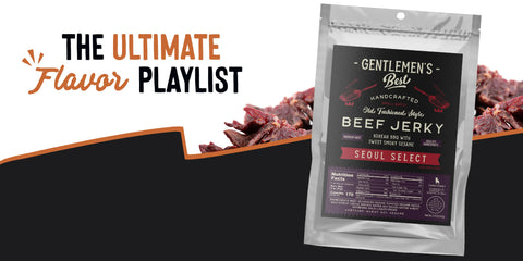Gentlemen’s Best handcrafted beef jerky in Seoul Select flavor, packaged in a silver pouch with black and red label. Described as ‘Korean BBQ with Sweet Smoky Sesame.’ Text above reads ‘The Ultimate Flavor Playlist’ in orange and black.