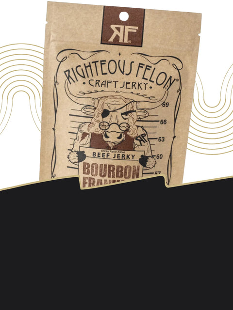 Craft jerky by Righteous Felon in Bourbon Franklin flavor. Brown kraft bag with a cartoon outlaw cow holding a mugshot board. Text highlights bourbon and vanilla bean flavor.