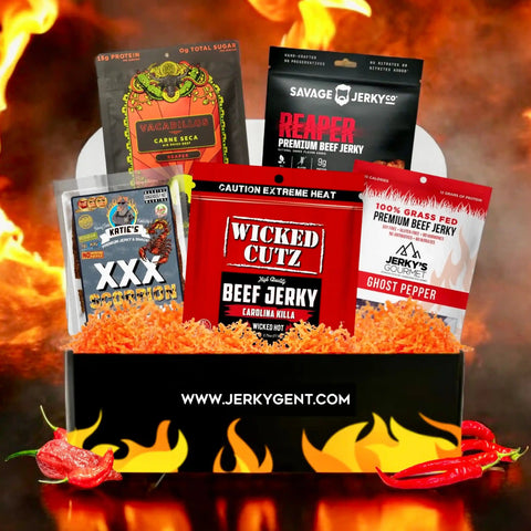 Inferno Beef Jerky Gift Box by JerkyGent featuring ultra-spicy jerky flavors like Carolina Reaper, Ghost Pepper, and Scorpion Pepper from top brands, displayed with flames and red hot peppers.