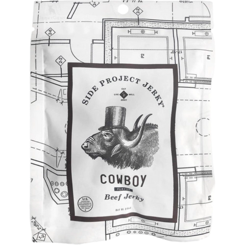 Side Project Jerky Cowboy flavor in white packaging with a buffalo in a top hat, highlighting a unique, low-fat coffee-infused beef jerky.